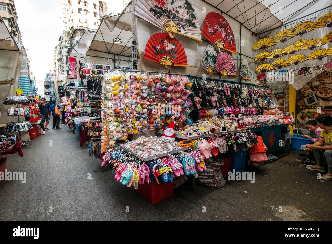 HongKong, China - November, 2019: Fashion, clothing and merchandise on street market (Ladie`s Market) in Hong Kong , Tung Choi Street Stock Photo